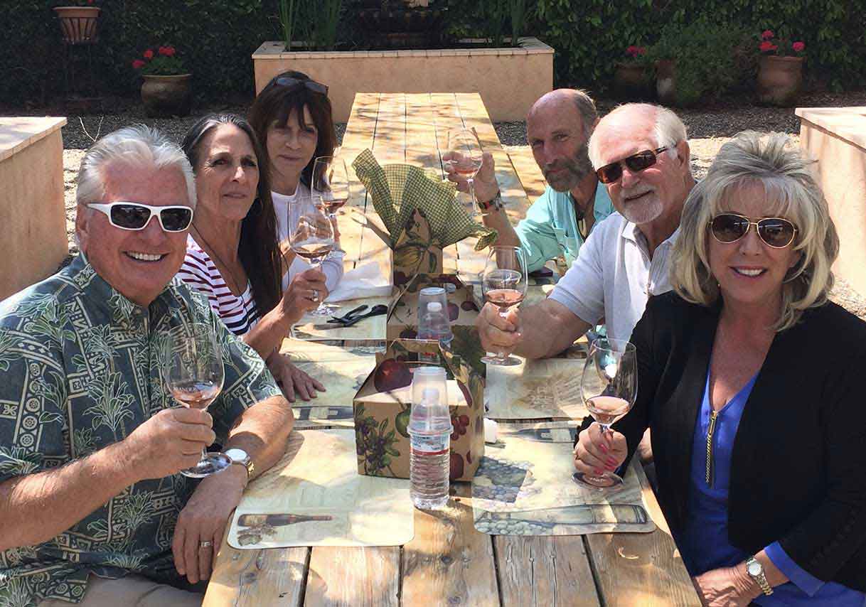 Group of six people enjoying a private wine tasting in Santa Barbara Wine Country – Santa Ynez, Ca